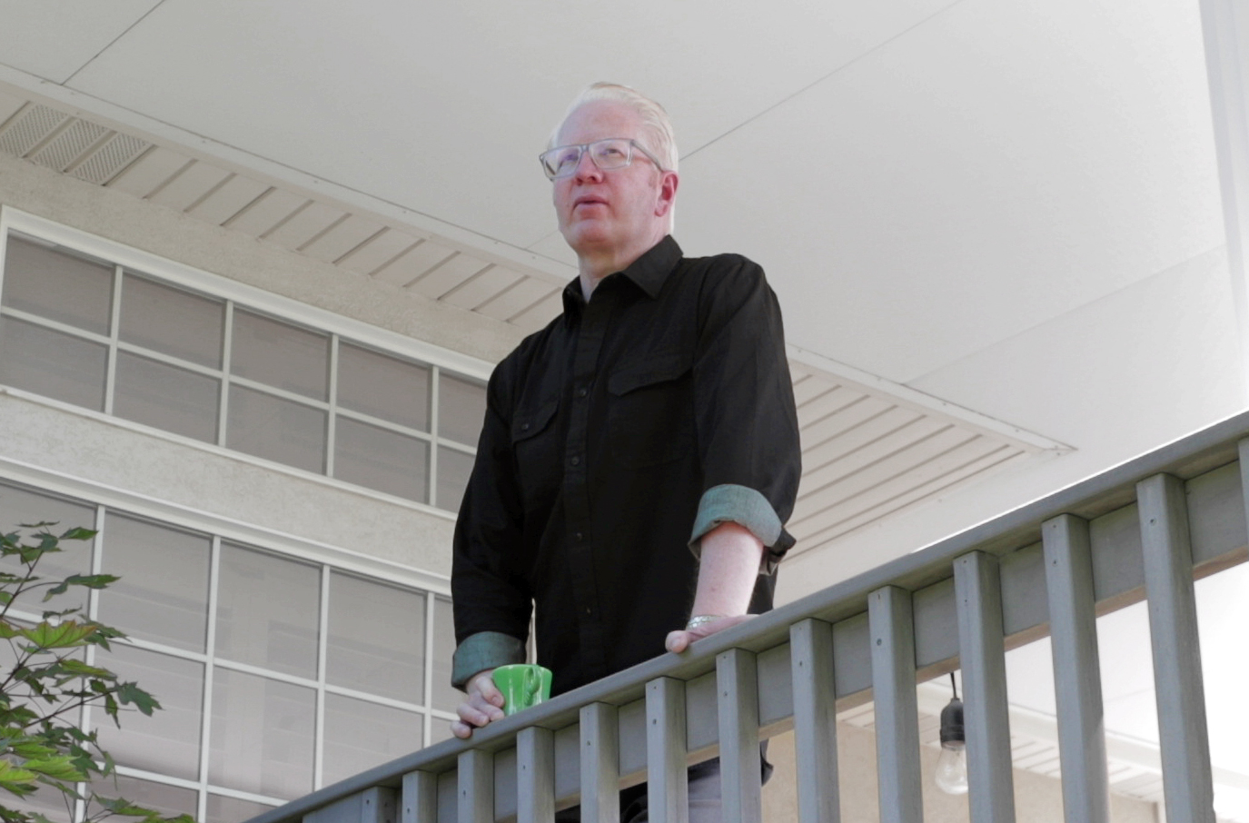 Happy male scientist wearing protective eyewear