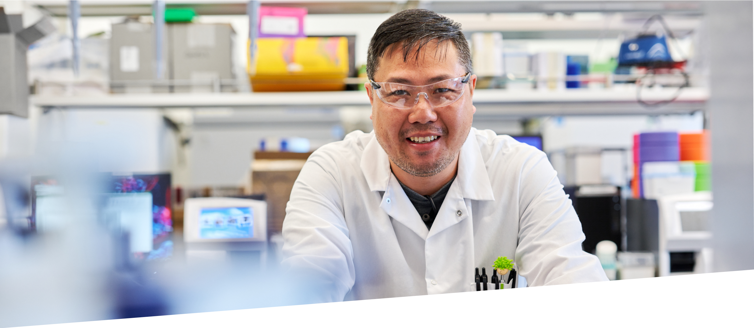 Scientist in lab smiling at camera