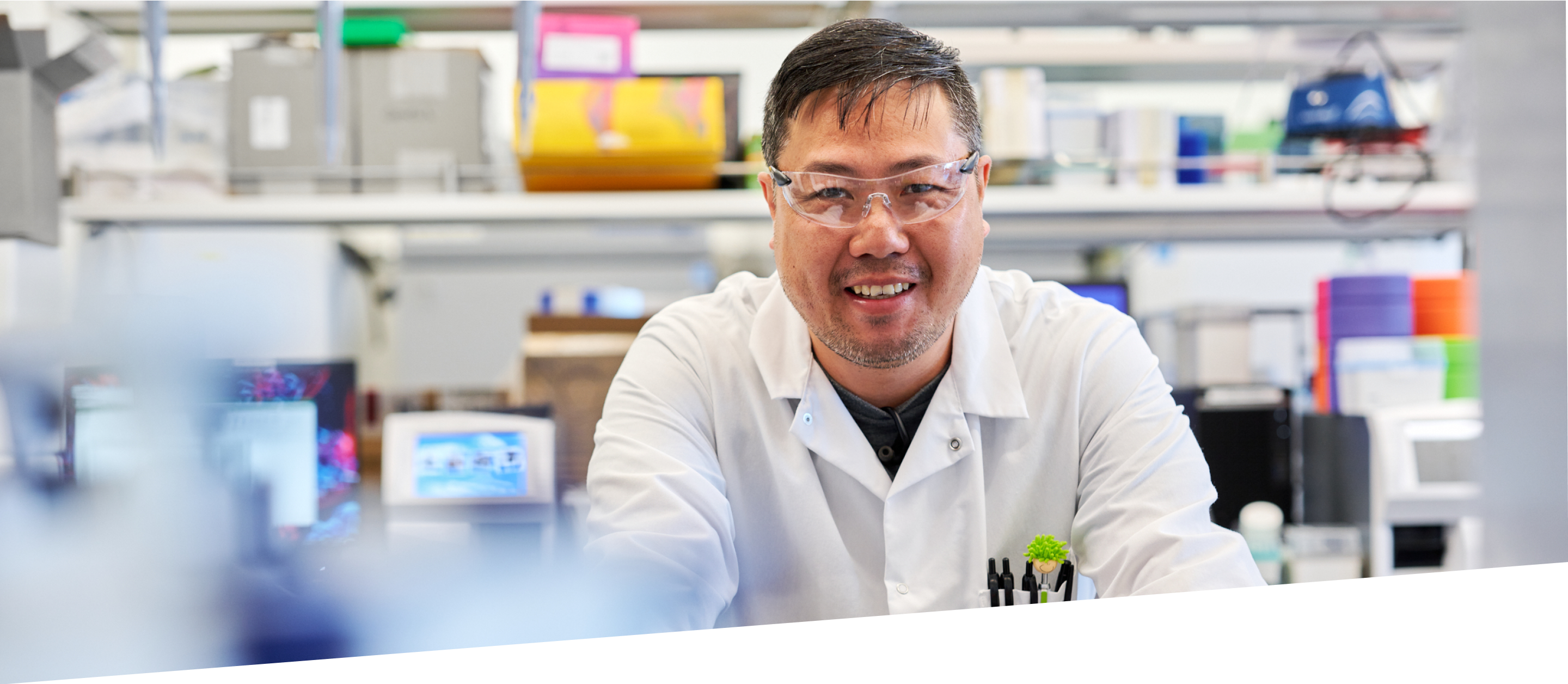 Scientist in lab smiling at camera