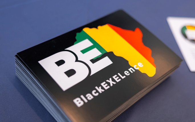 Black EXELence logo on sticker