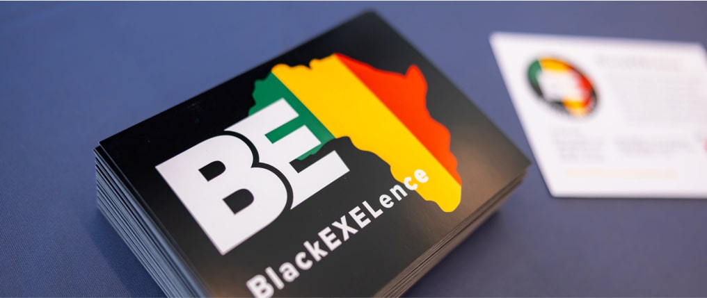 Black EXELence logo on sticker