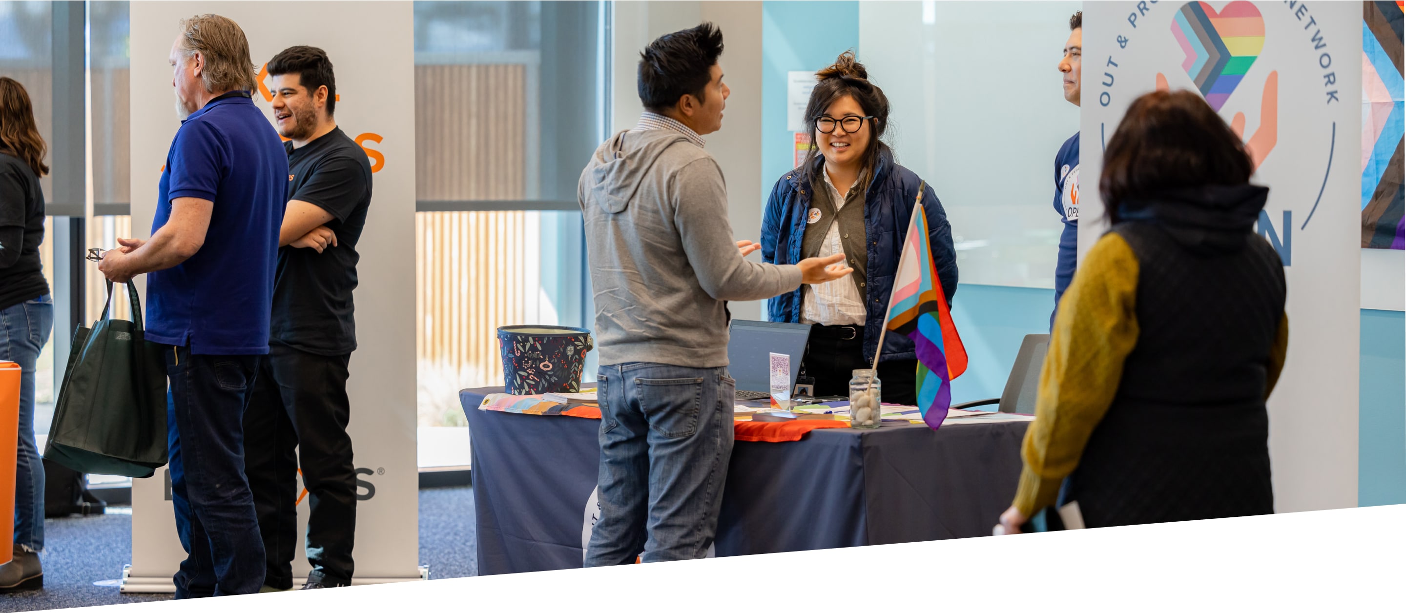 Employees hosting a table at a community event