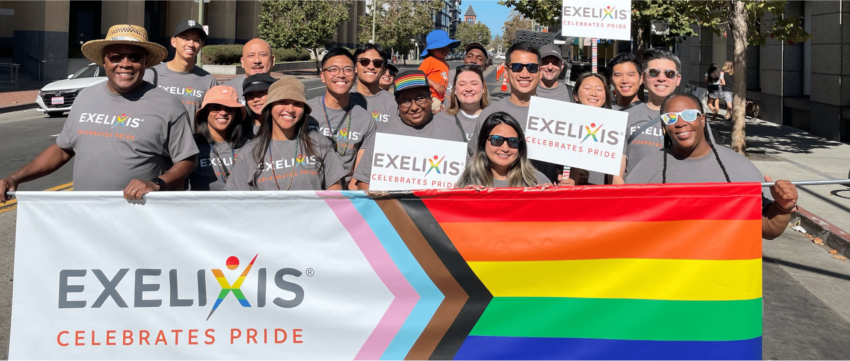 Employees holding pride celebration flag in parade