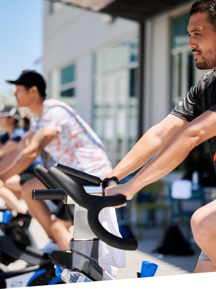 Group spin class held outdoors at Exelixis