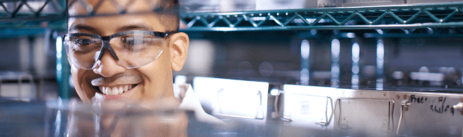 Male scientist smiling in oncology lab